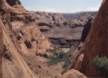 Lower portion of the Hole-in-the-Rock crevice prior to Lake Powell. The river was crossed on a ferry constructed and operated by Charles Hall. Lamont Crabtree Photo